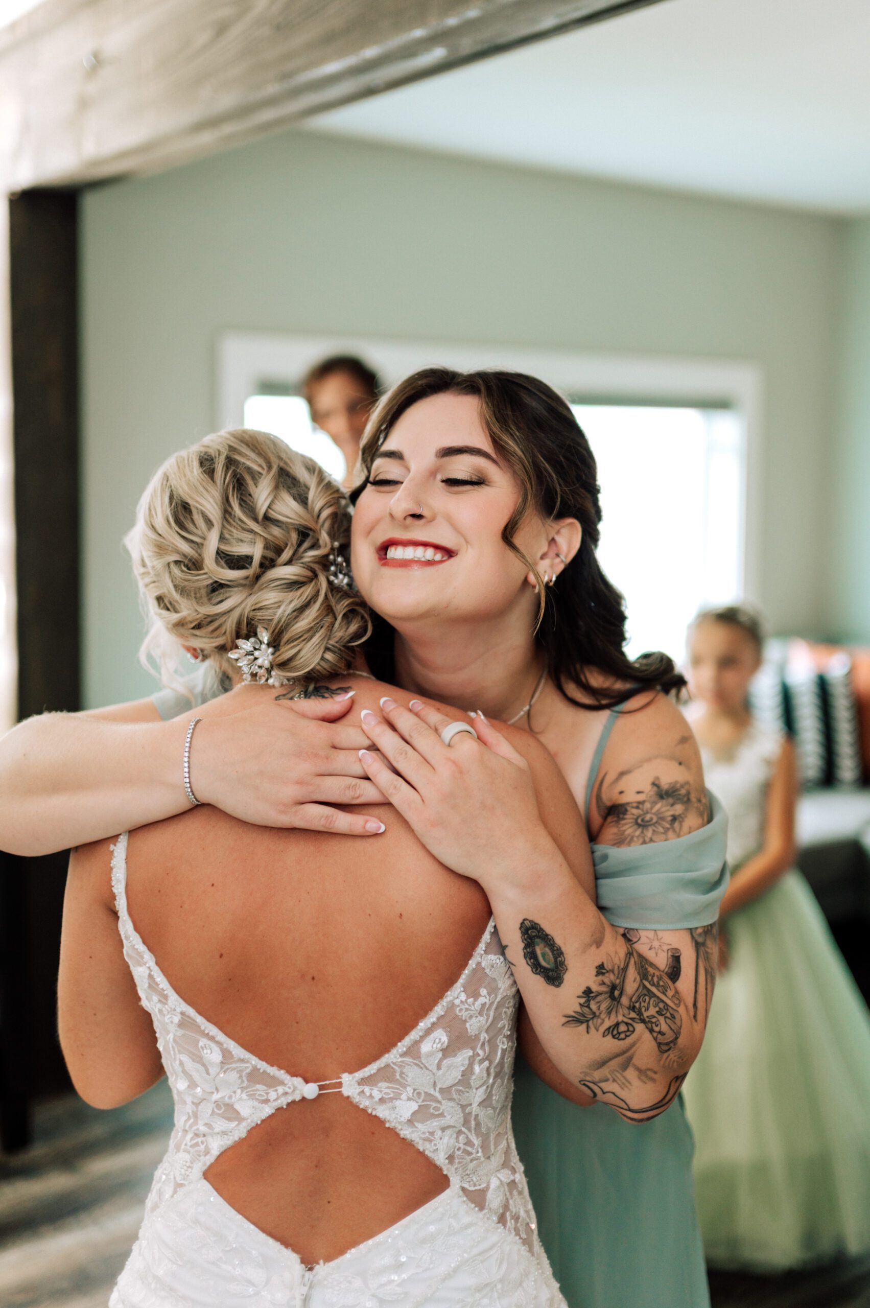 Bride with professional hair and makeup in motion on her wedding day in Fort Wayne, showcasing long-lasting, photo-ready bridal beauty