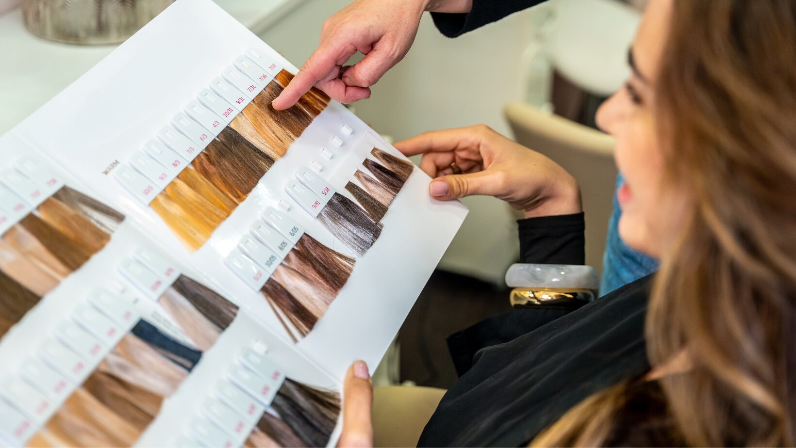 Professional hair color consultation at The Red Stiletto salon in Fort Wayne