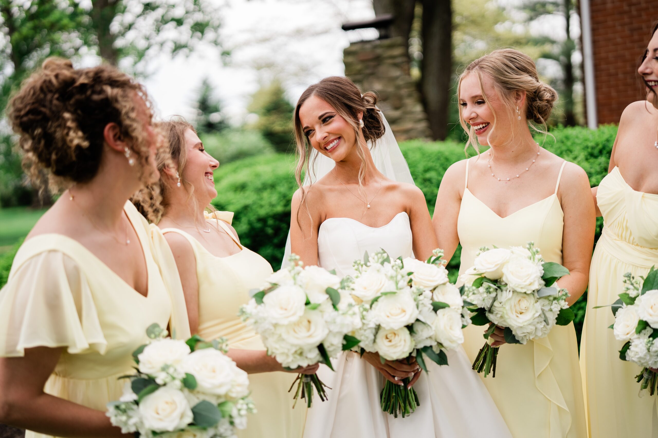Bride with professionally styled hair and makeup ready for her wedding day by The Red Stiletto bridal beauty team.