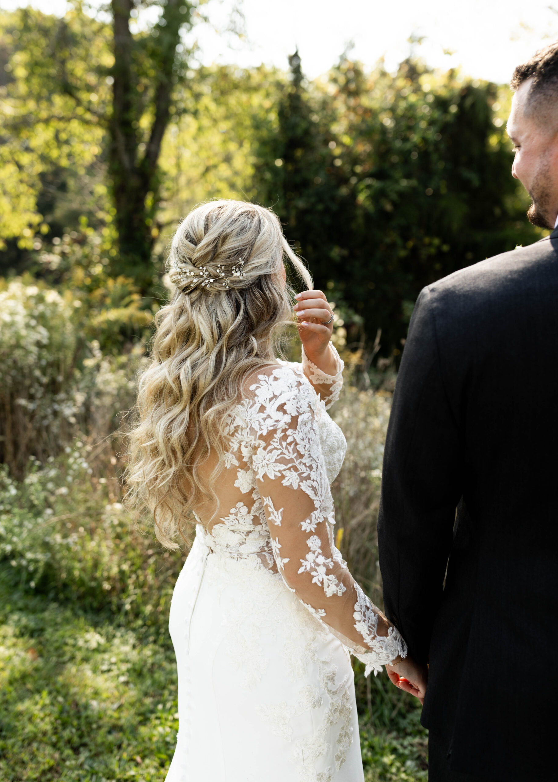 Bride wearing bridal hair extensions with structured Hollywood waves