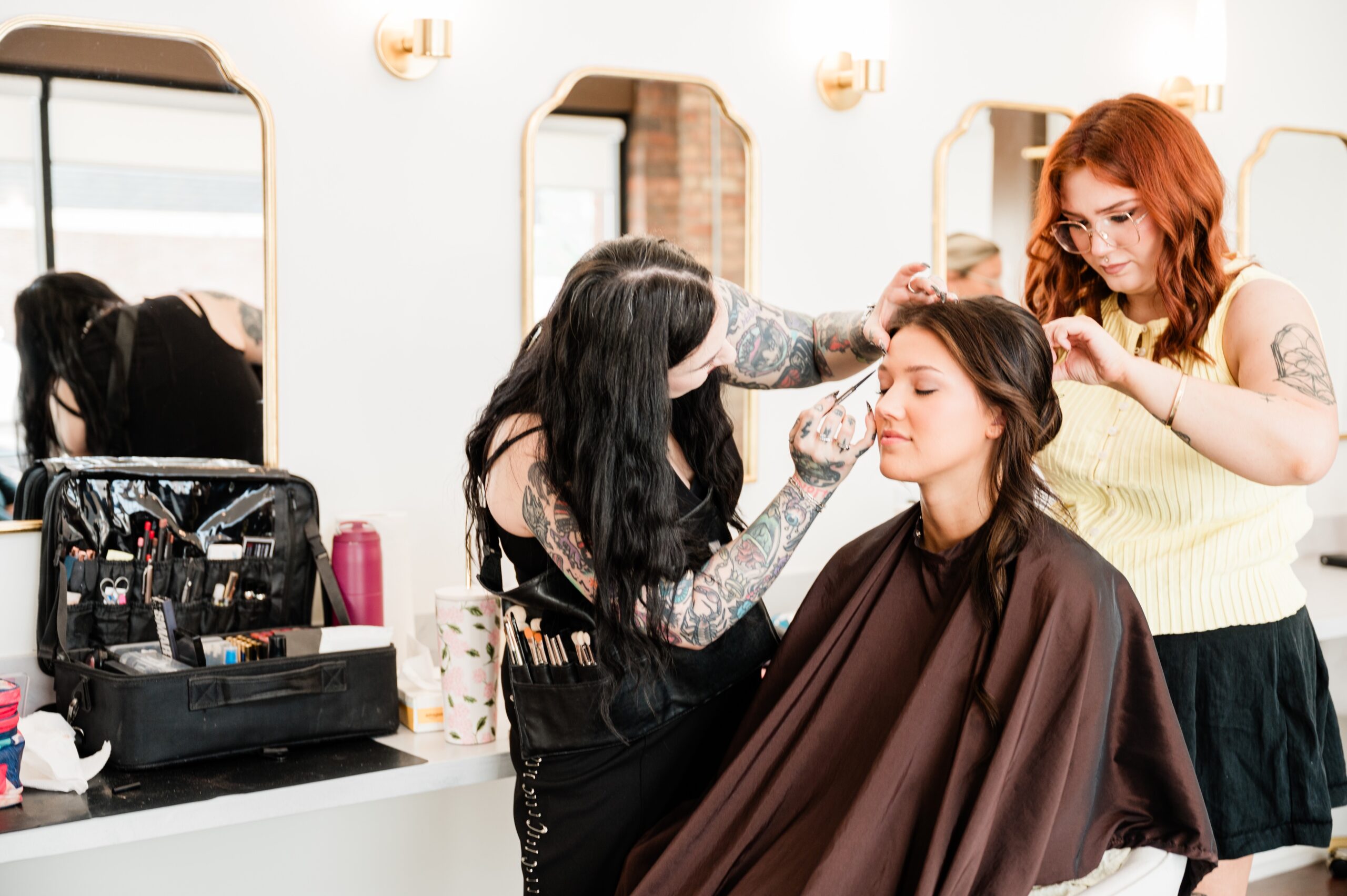 The Red Stiletto wedding hair and makeup team getting a bridal party ready for a wedding.