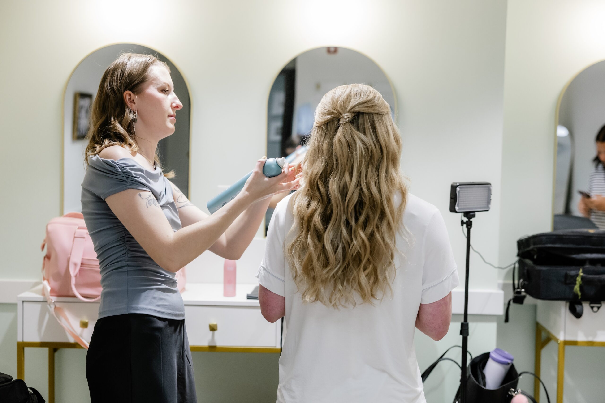The Red Stiletto bridal beauty team providing wedding hair and makeup to keep the wedding morning on schedule.