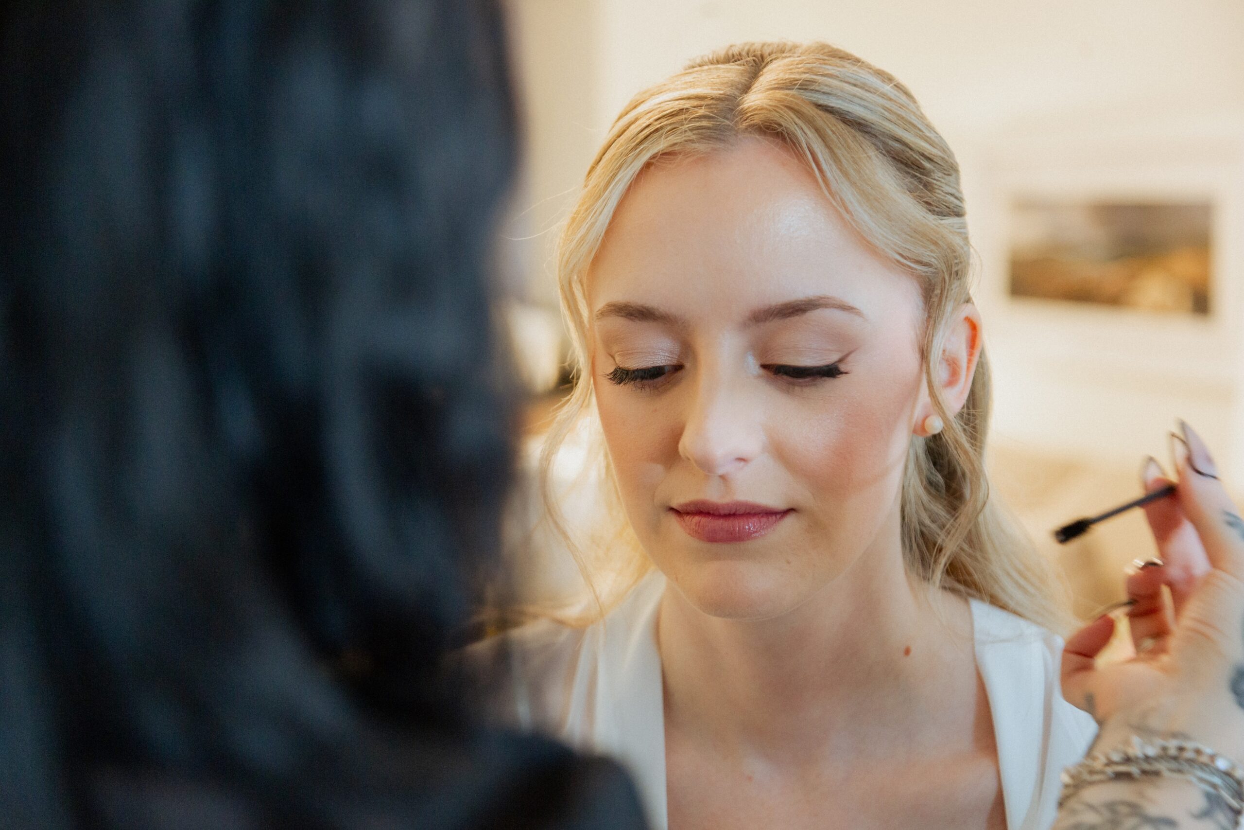 Bride with professional wedding hair and makeup by The Red Stiletto bridal beauty team
