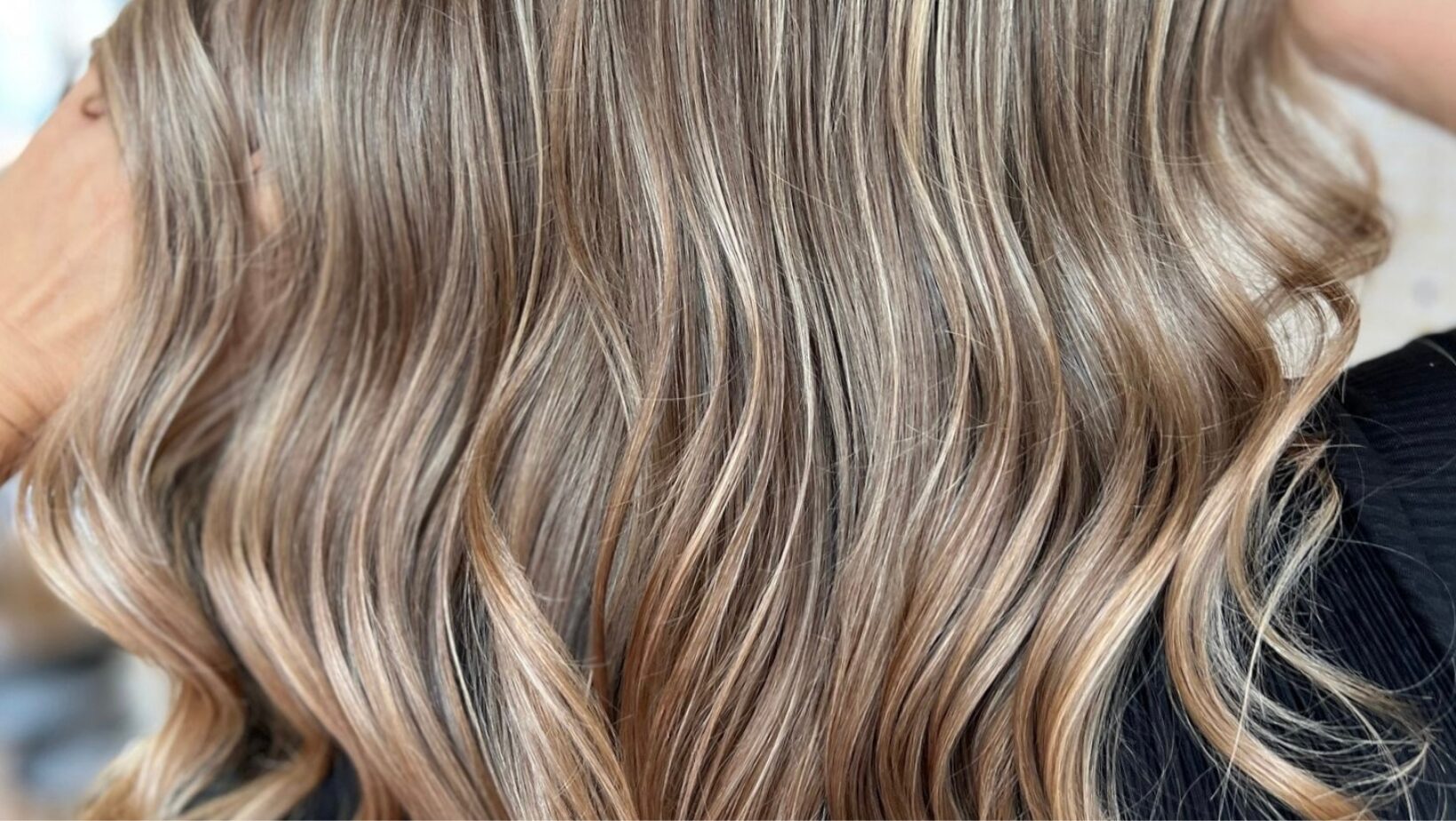 Dimensional blonde balayage and highlights at The Red Stiletto hair salon in Fort Wayne, Indiana